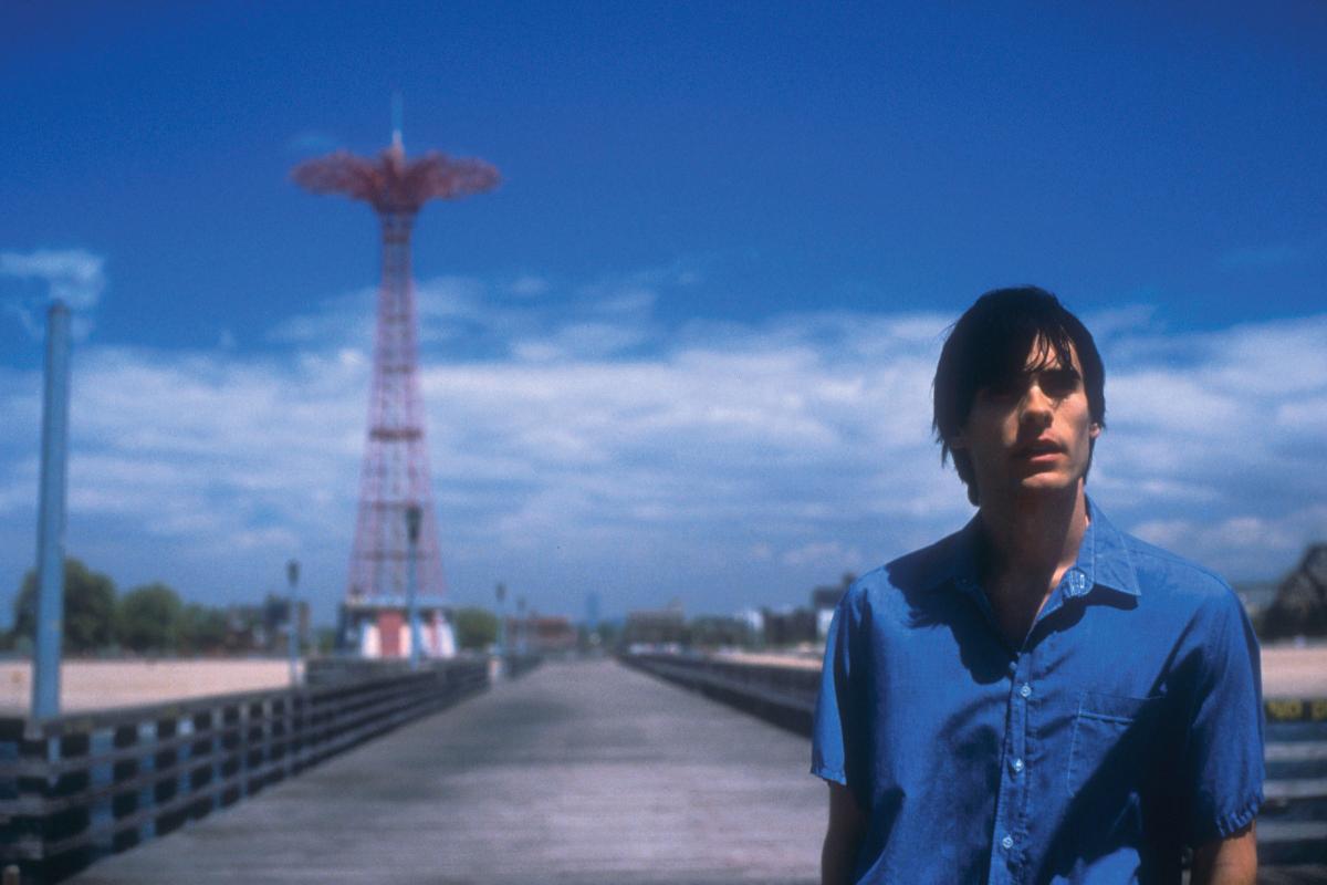 Movie still from Requiem for a Dream, showing the protagonist in a blue shirt at Coney Island