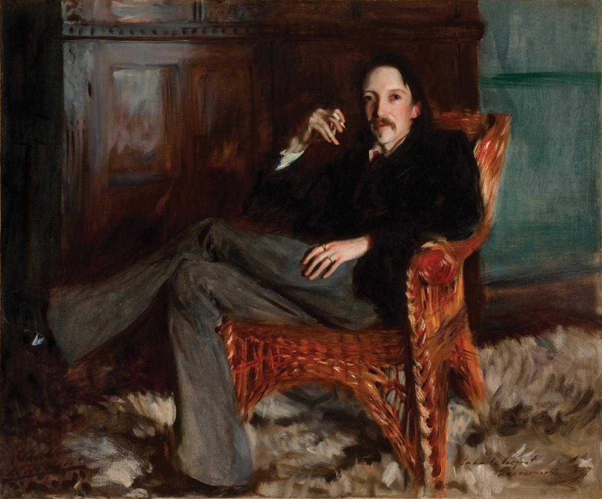 Stevenson sitting in a leather arm chair, legs crossed, holding a cigarette, wearing a dark suit