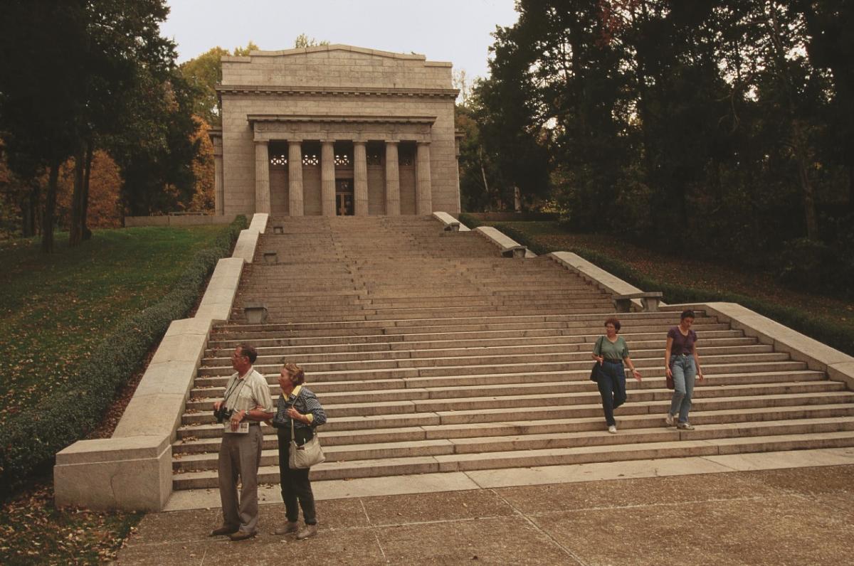 Photograph of steps leading up to a small temple with columns 