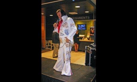 Photograph of a man dressed like elvis