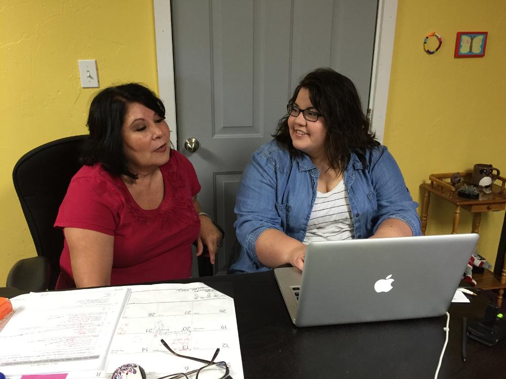 Linda Bear (on left) working with Sarah Martin.