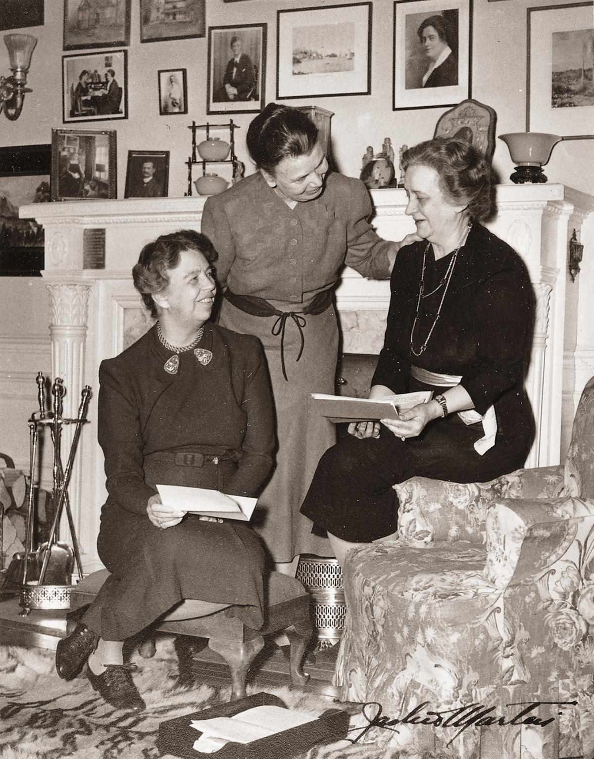 Three women in black and white photograph in the White House in the 1940s.