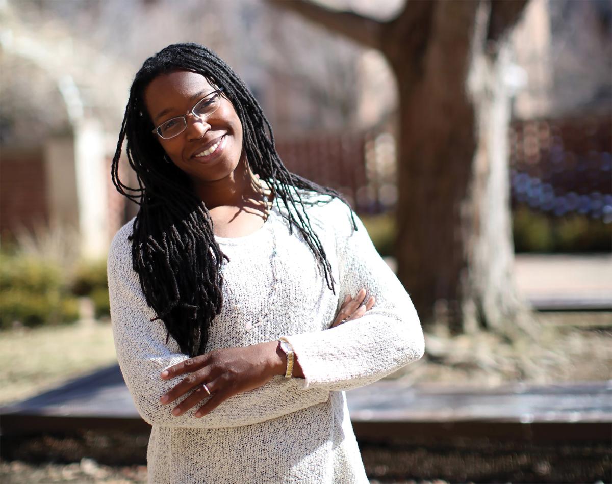 Photograph of author Tiya Miles, outside wearing a white dress