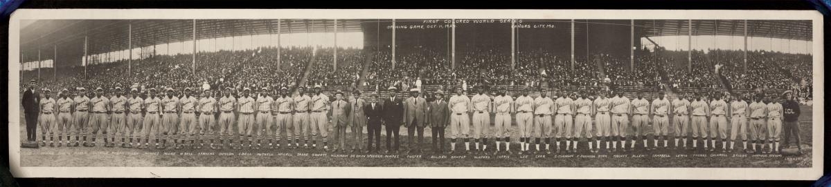 Black and white horizontal photo of two teams lined up before the first Negro World Series.