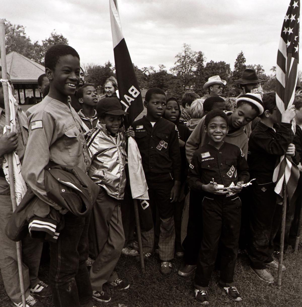 black and white photo of a troop of Black boy scouts at awards ceremony