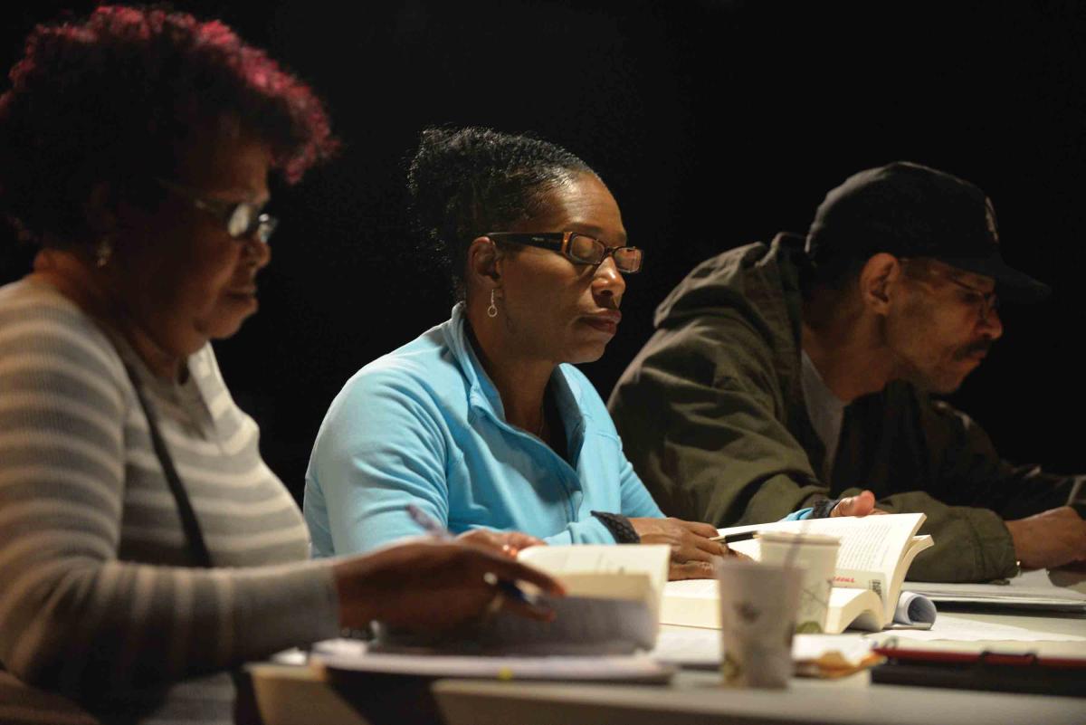 Students in a Clemente course read about the Montgomery bus boycott