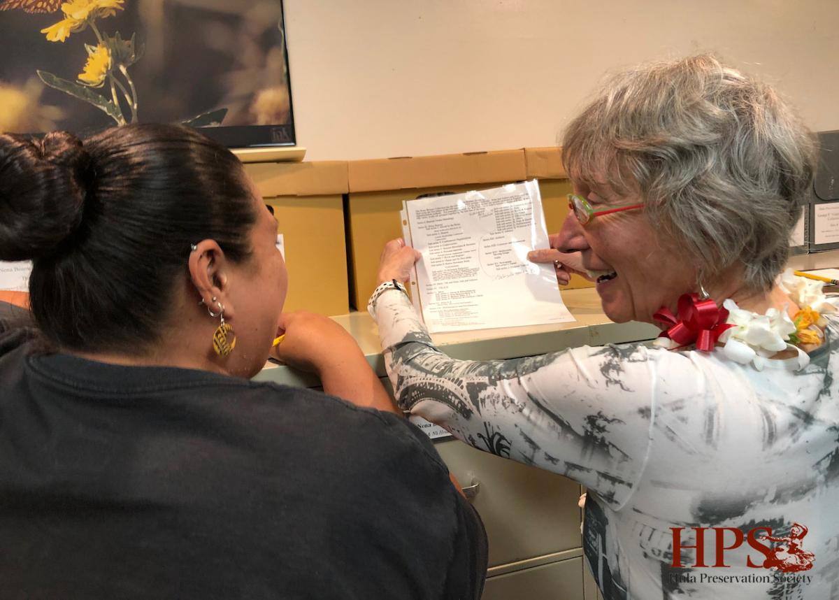 Consultant Jeanne Drewes (right) works with Collections Manager Keau George (left) on initial assessments of the HPS Archive.