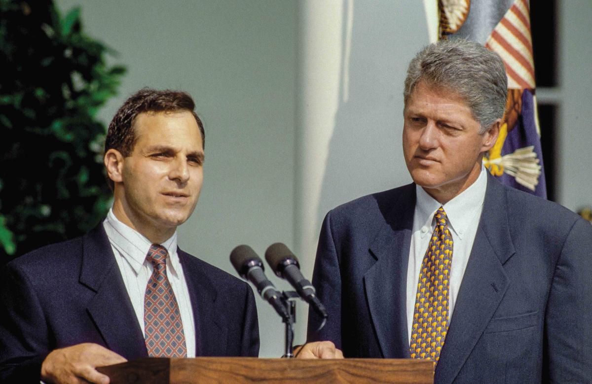 Louis Freeh and Bill Clinton at a podium