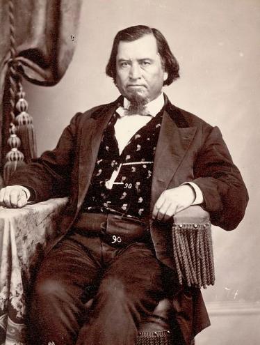 black and white photo of seated man in suit from the Civil War era
