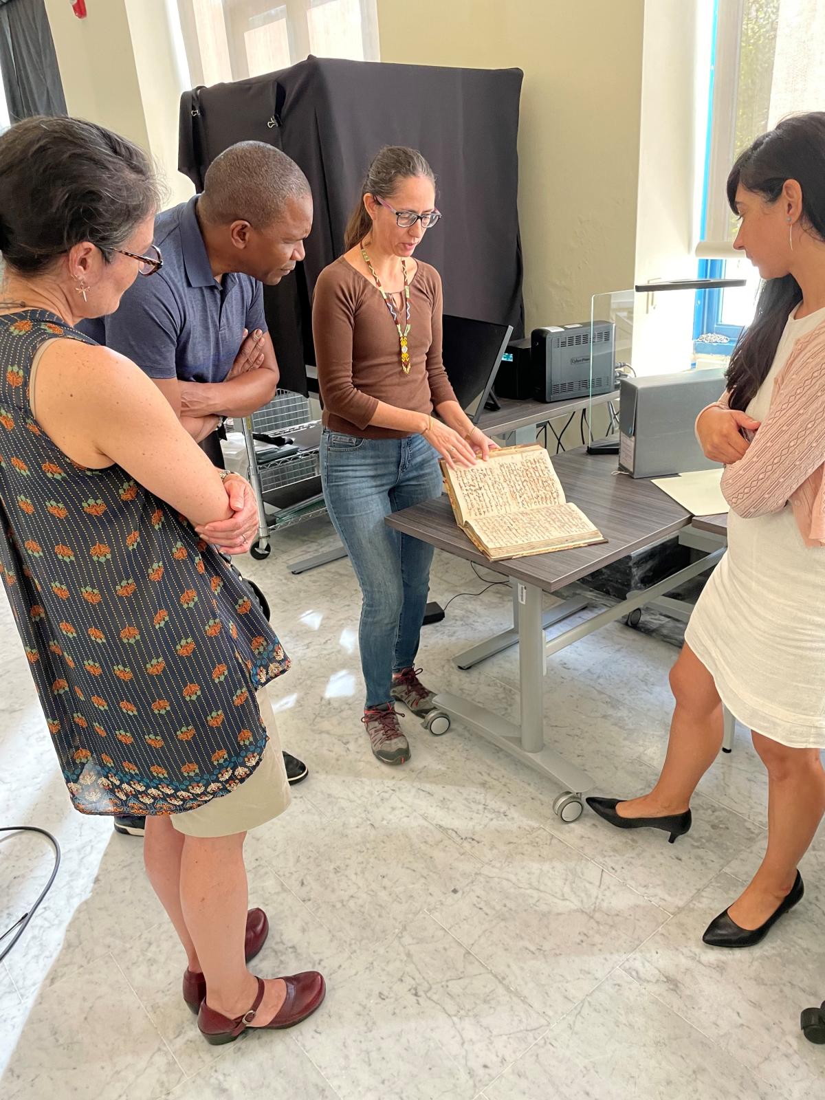 Chair Shelly Lowe and Senior Deputy Chair Anthony Mitchell meet with members of the General Archives of Puerto Rico team, recipients of NEH funding.