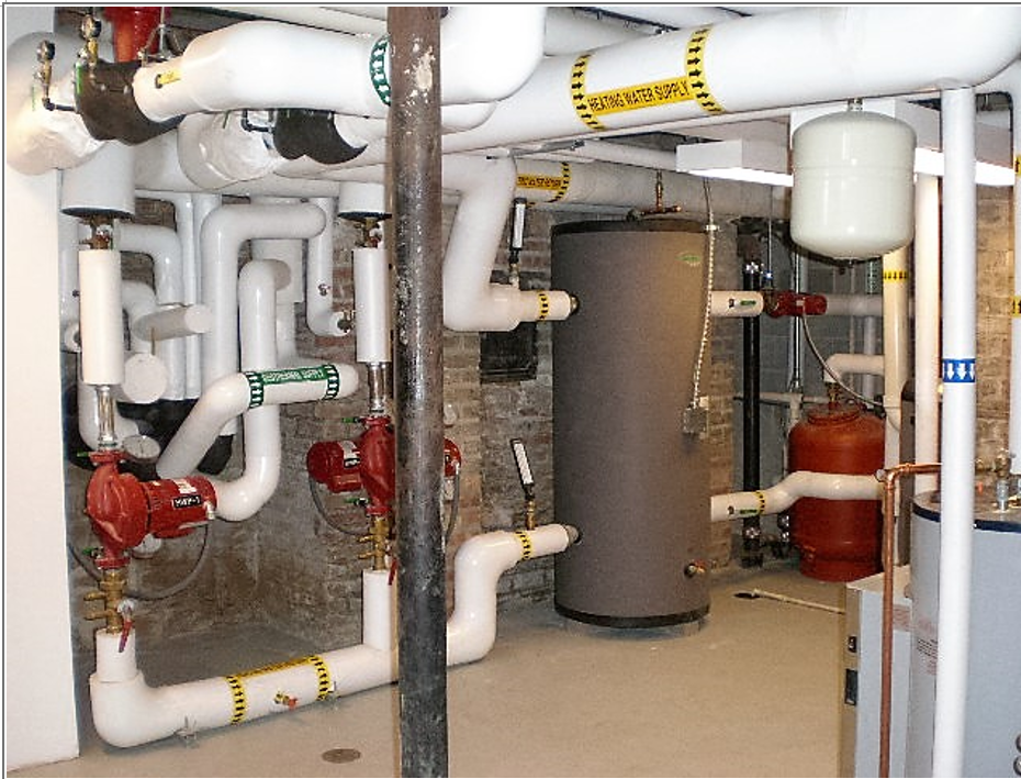 The Evanston Historical Center basement, where pipes come in from the outside and feed the system.