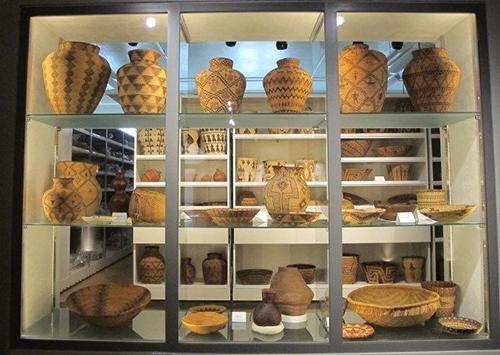 View looking in the visible vault window from the interpretive gallery for basketry.