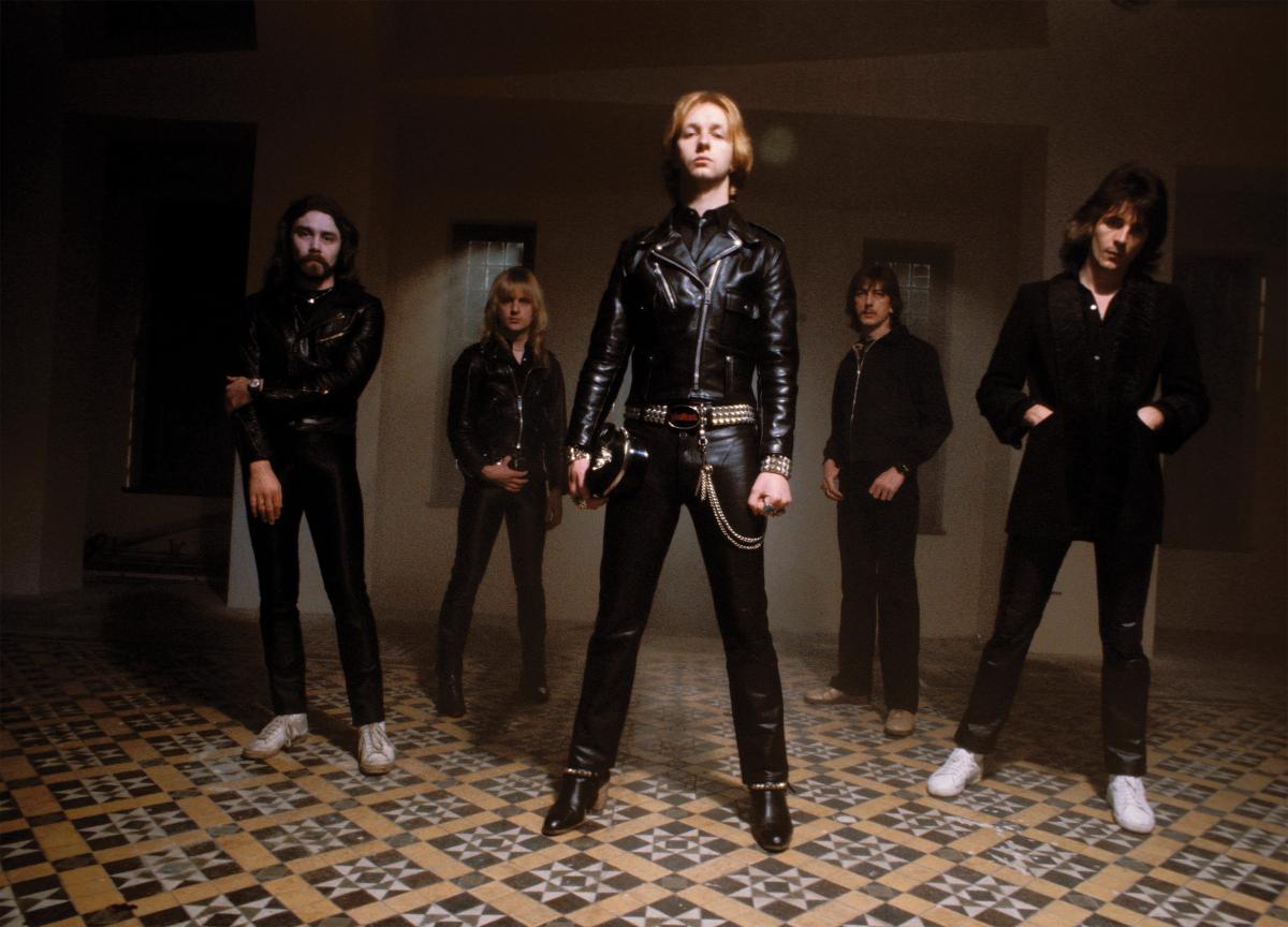 Members of the band Judas Priest posing for the camera