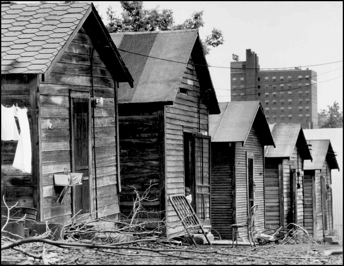 black and white photo of shacks in the Black neighborhood of Columbia