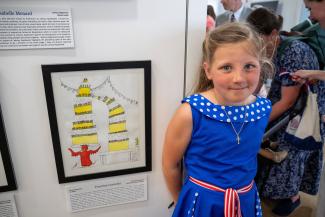 student Faustina at American Heroes Student Art Contest exhibition