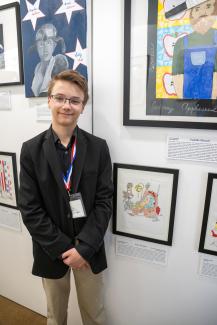 student Tate with Ben Franklin drawing
