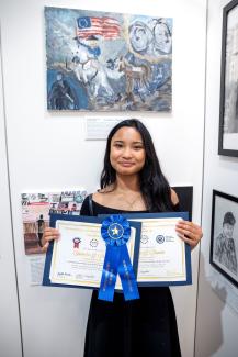 student Ysobella at American Heroes Student Art Contest exhibition