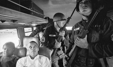 Members of the U.S. Army escort Freedom Riders