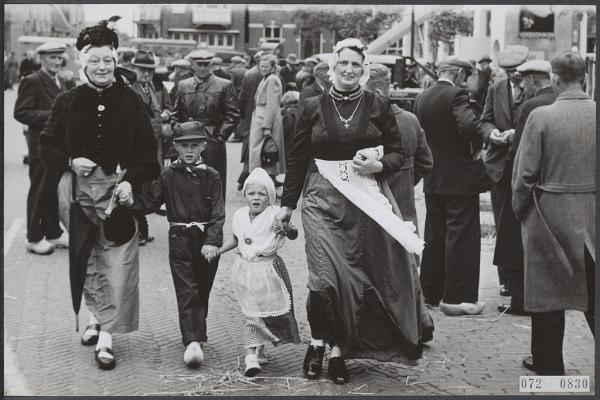 Women and children dressed in folklore costumes.