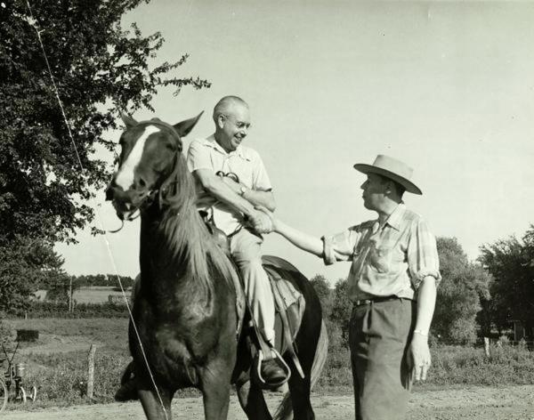Arthur B. Church and Kark Koerper at KMBC farm with a horse