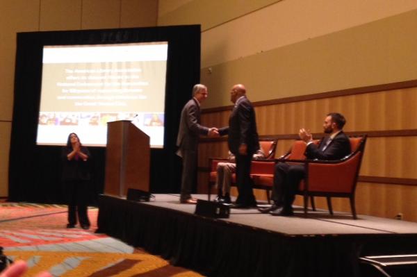 NEH Chairman William Adams and Congressman John Lewis shaking hands