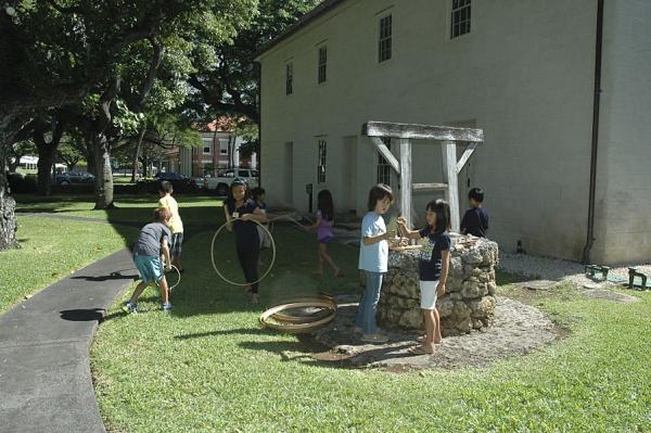 Children playing near a well
