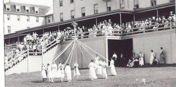 Women wrapping the may pole 