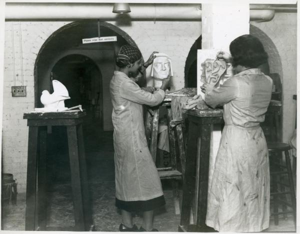 Two women working in sculpture studio at Wellesley College