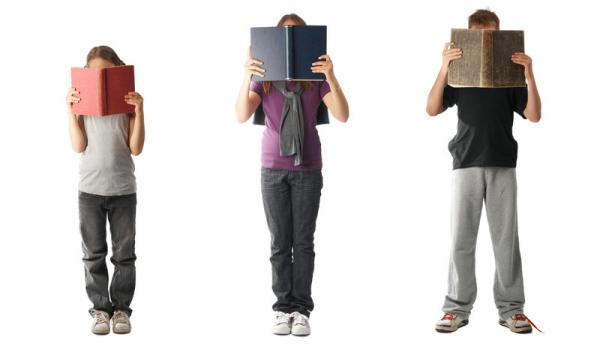 photo: three kids holding books