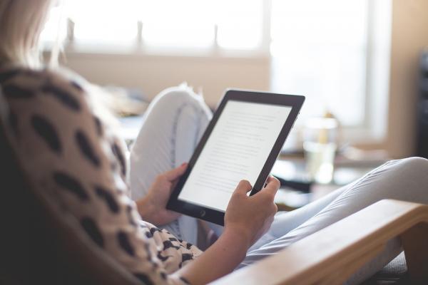 Woman reading on a kindle