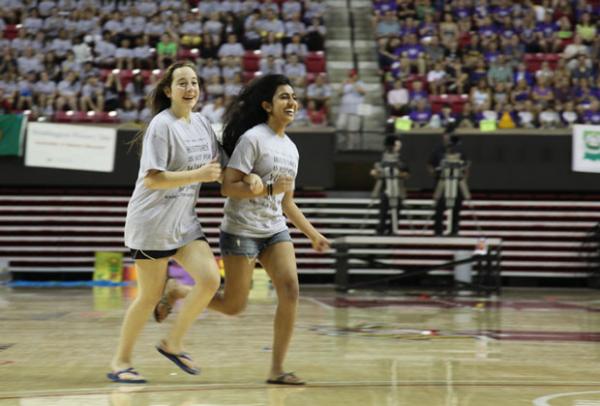 National History Day students run in arena to receive award