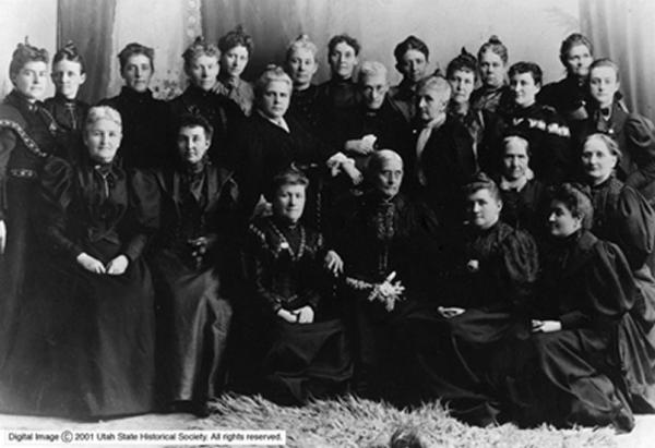 Utah suffrage leaders, including Martha Cannon, Emily S. Richards, Sarah Kimball, Emmeline B. Wells, Zina D. Young, along with Colorado suffrage leaders Mary C. C. Bradford and Lyle Meredith Stansbury, accompany Susan B. Anthony and Rev. Anne Howard Shaw.