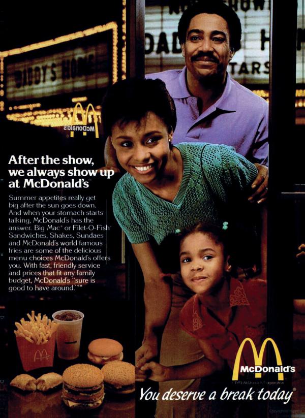 Black mother, father, and child in "You Deserve a Break Today" advertisement