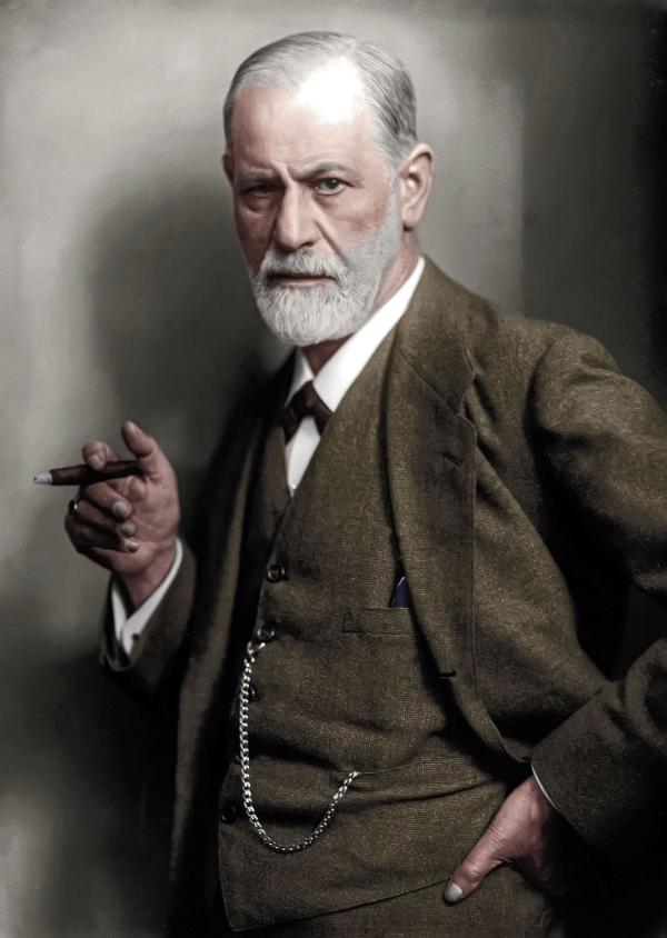 Colorized photo of Sigmund Freud holding a cigar. 