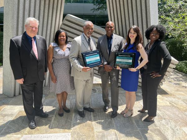 NEH staff holding 2021 Best Places to Work awards