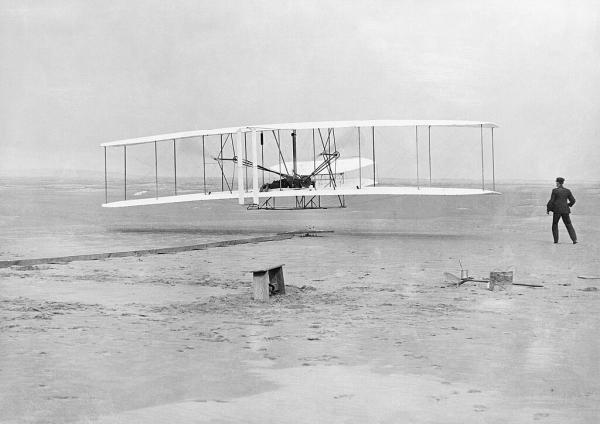 The Wright Flyer airborne during the first powered flight in Kitty Hawk, North Carolina, on December 17, 1903.