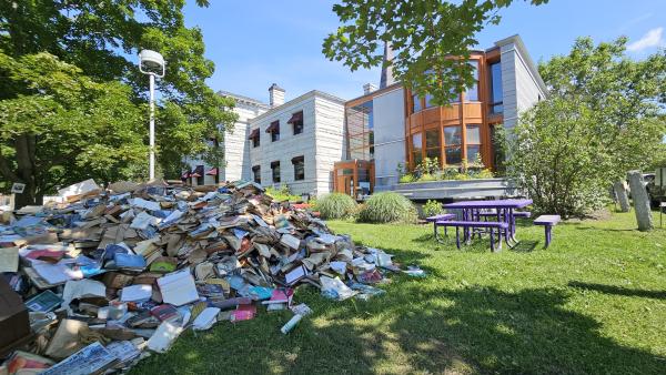 pile of books destroyed by flood water