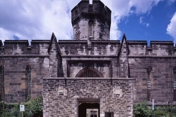 Outside the front gate of Eastern State Penitentiary on a sunny day