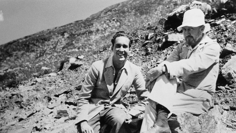 A young James Laughlin and Ezra Pound in Rapallo, sitting on the rocks