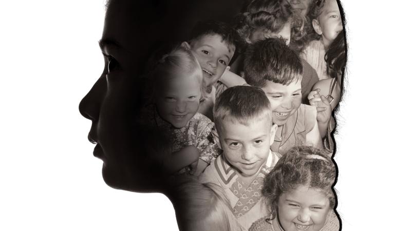 silhouette of a woman, with photos of children superimposed on top of the silhouette