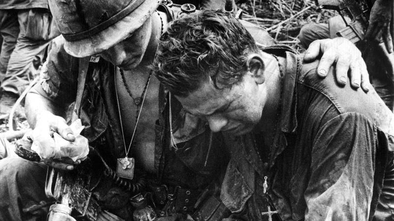 Black and white photograph of two American soldiers in Pleiku, South Vietnam