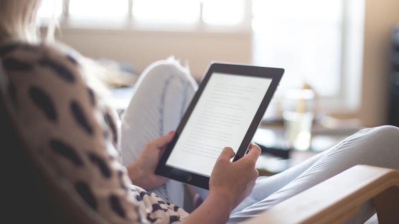 Woman reading on a kindle