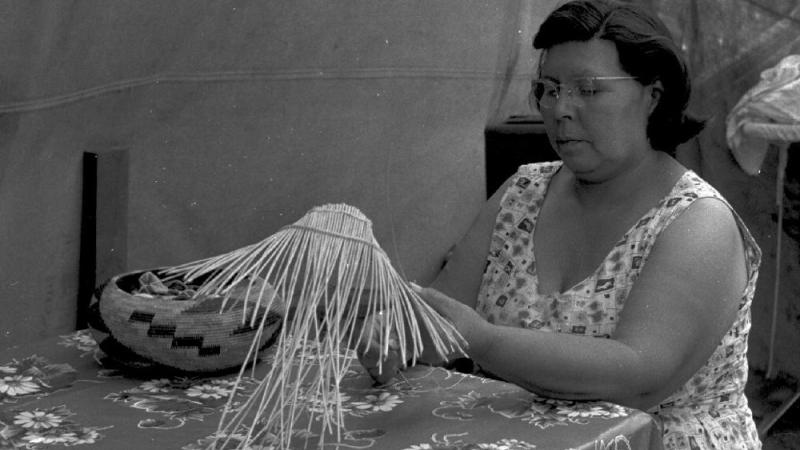 Essie Parrish weaving baskets, c. 1960s.