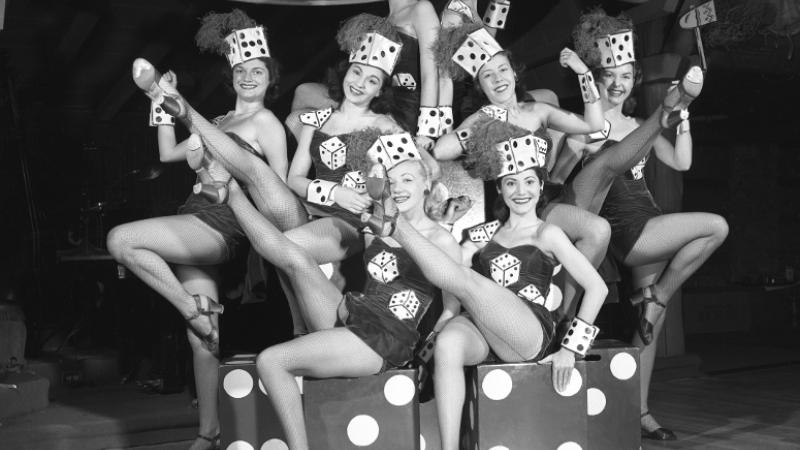 black and white photo of women onstage in costumes