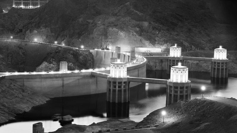 black and white photo of the Hoover Dam at night