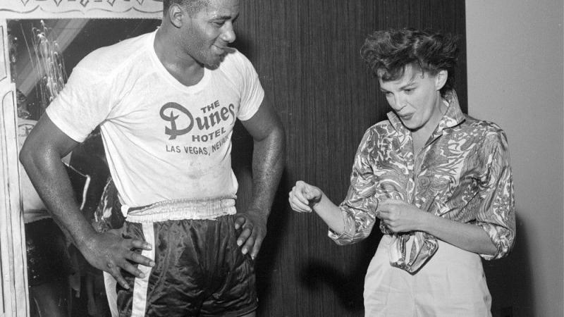 black and white photo of Judy Garland and Floyd Patterson
