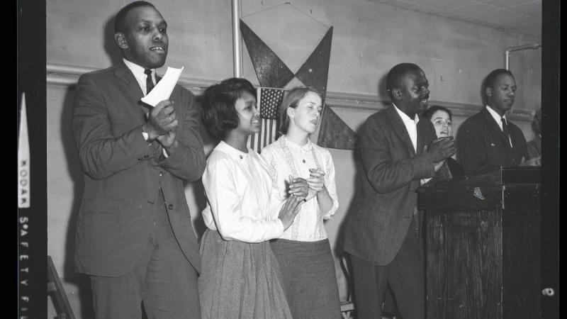 black and white photo of people onstage