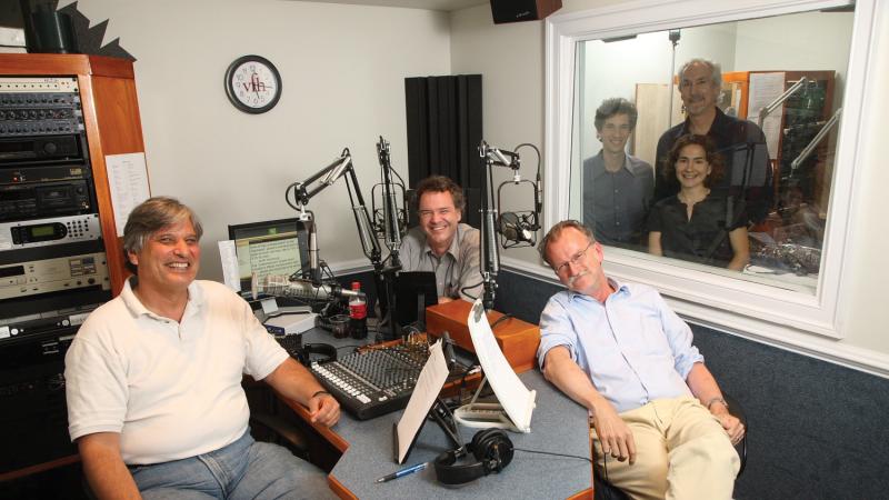 The team lounges in their studio, surrounded by their recording equipment