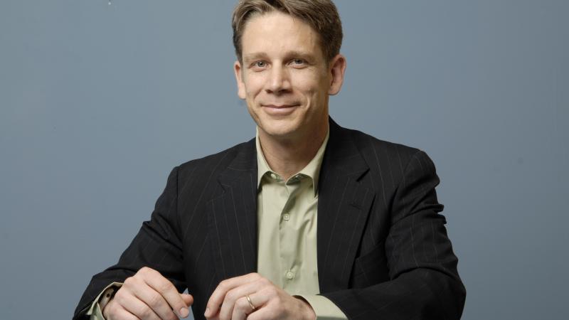 Photograph of a man on a grey background