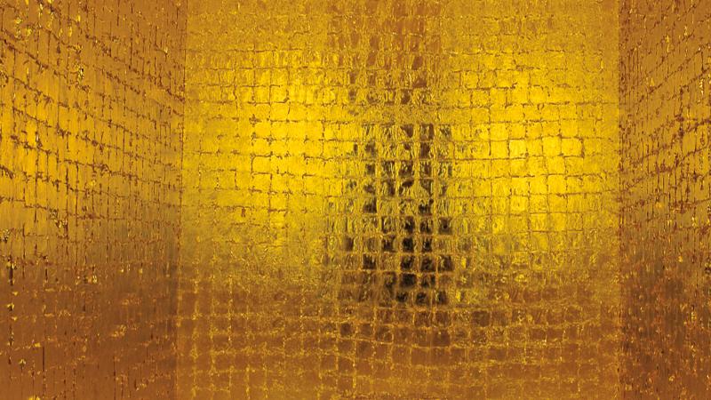 Shimmering gold square tiles panel a room